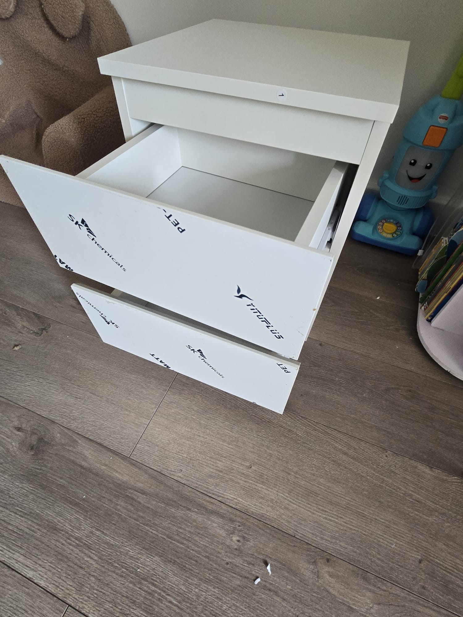 White bedside table with drawers assembled